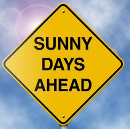 sign with the words sunny days ahead